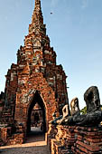 Ayutthaya, Thailand. Wat Chaiwatthanaram, Buddha statues and one chedi of the gallery. 